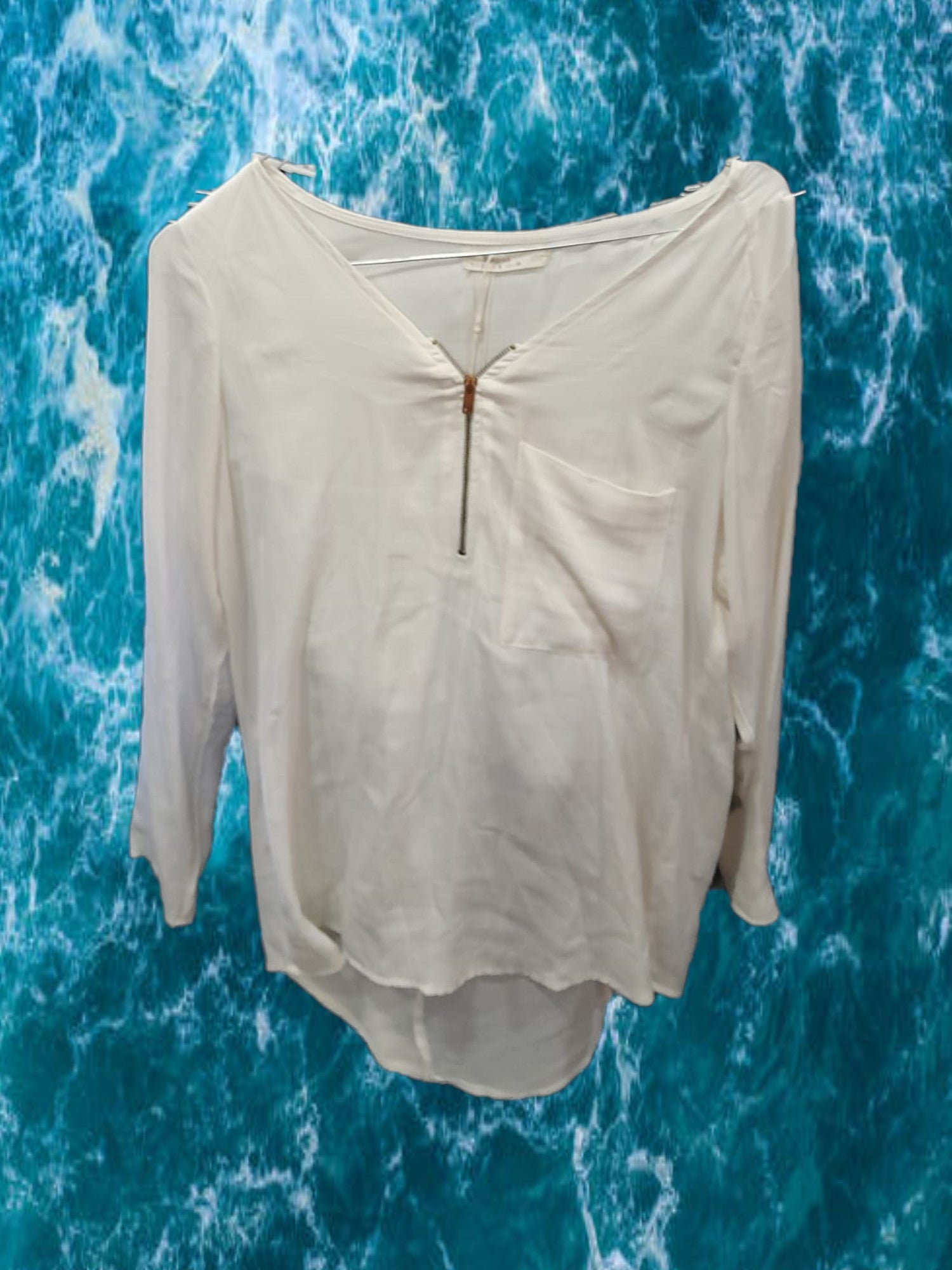 BLUSA MANGA LARGA BLANCA CON CREMALLERA EN ESCOTE