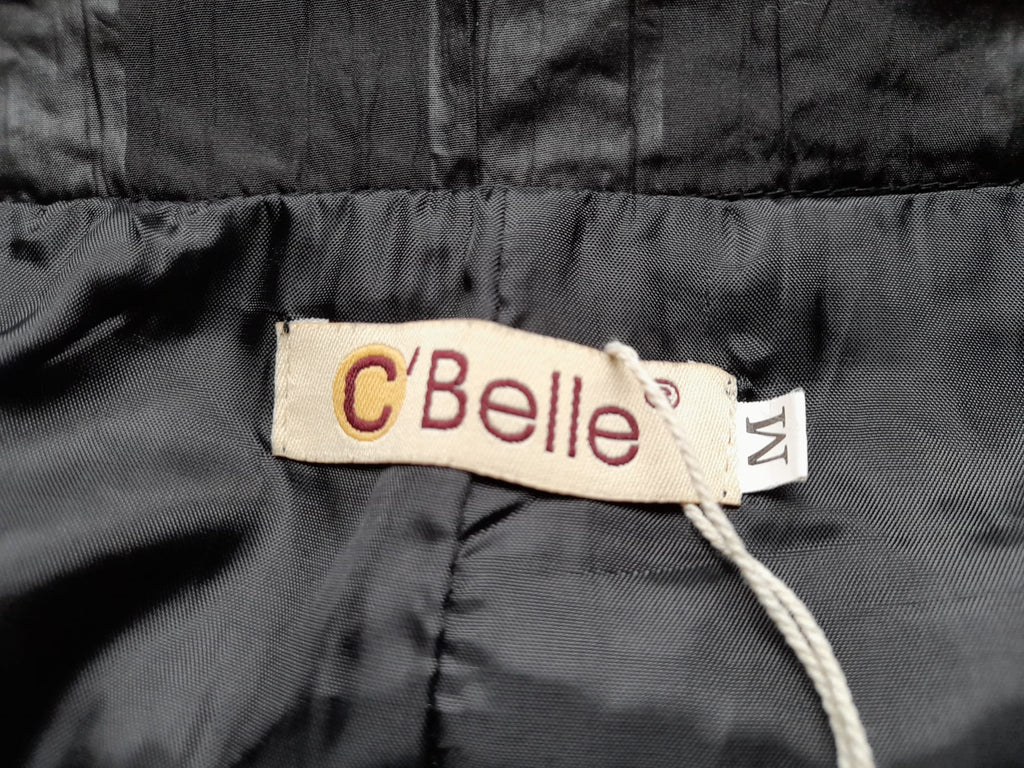 PANTALÓN NEGRO CON FORRO INTERIOR DE VESTIR CON VOLANTES EN TOBILLO