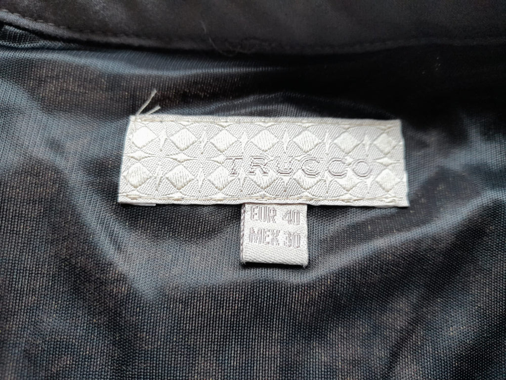 MINI FALDA NEGRA CON FORRO Y CREMALLERA, ESTAMPADO BORDADO GEOMÉTRICO