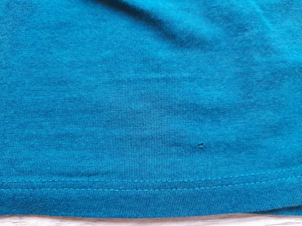 CAMISETA TIRANTE VERDE MAR (PEQUEÑO ROTO PARTE BAJA DELANTERA)